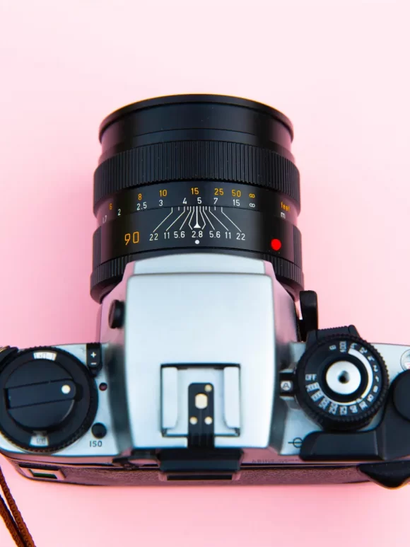 Top view of a camera with different camera mode dials